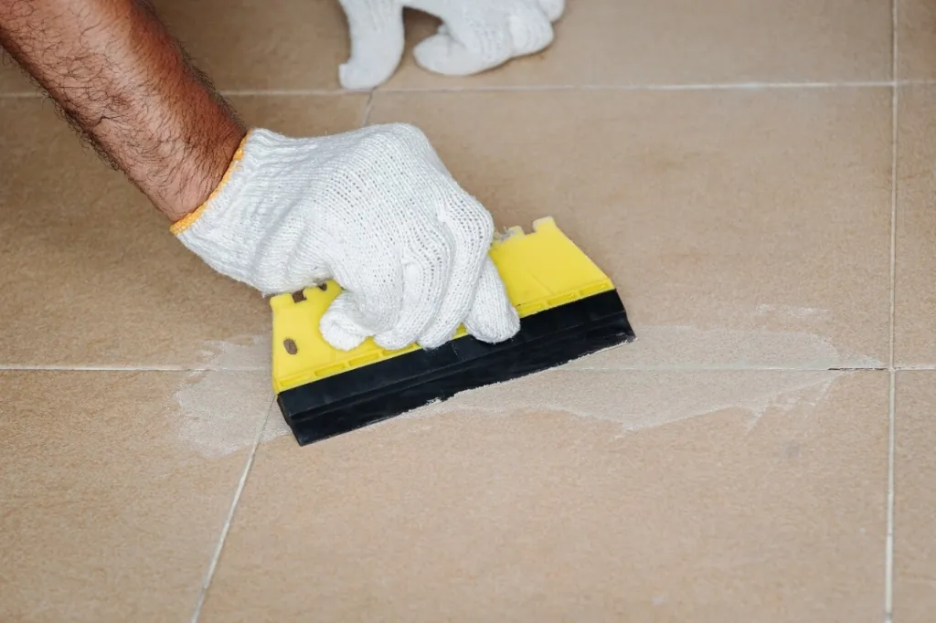 Tile and precision machine joint grouting with chemical resistant epoxy grout float