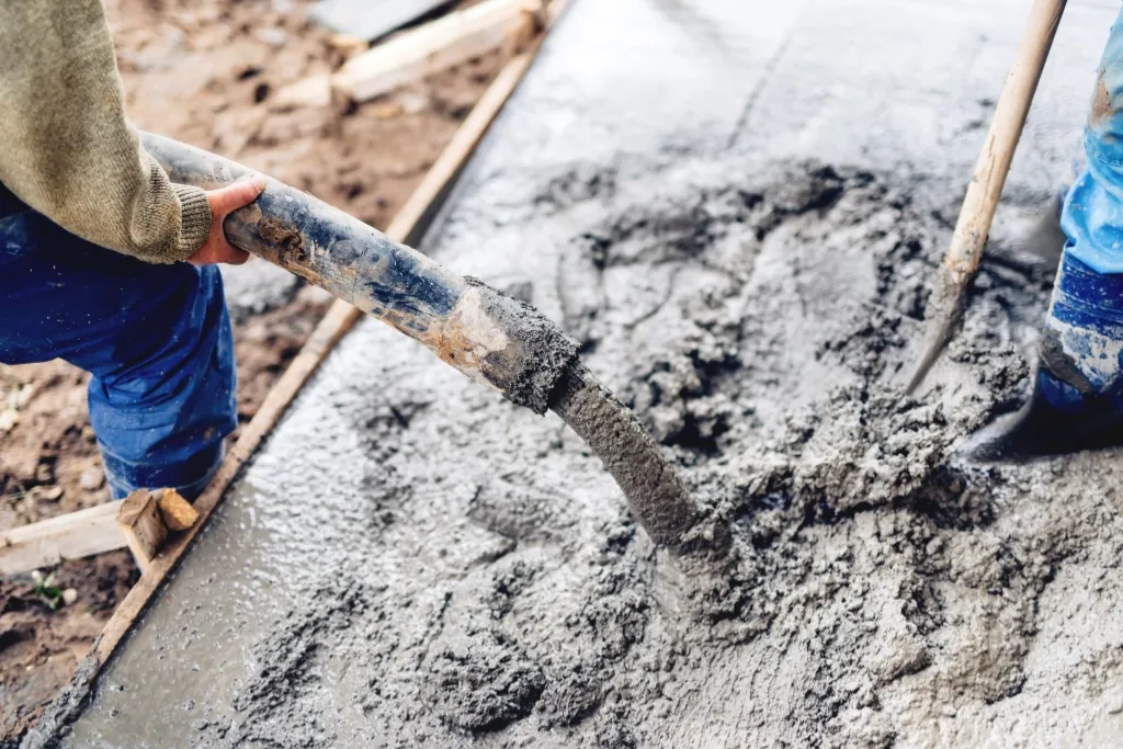 High-fluidity micro concrete pumped and placed onto reinforced concrete foundation