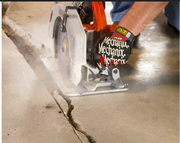 Circular saw cutting a clean V-groove channel along a concrete crack